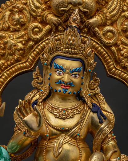 Close-up of Vaisravana Namtoshe copper statue holding a jewel-spitting mongoose and parasol