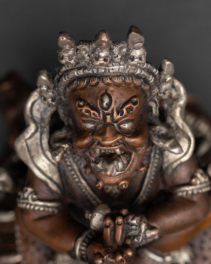 close up of vajradaka statue with wrathful expression and intricate jewelry