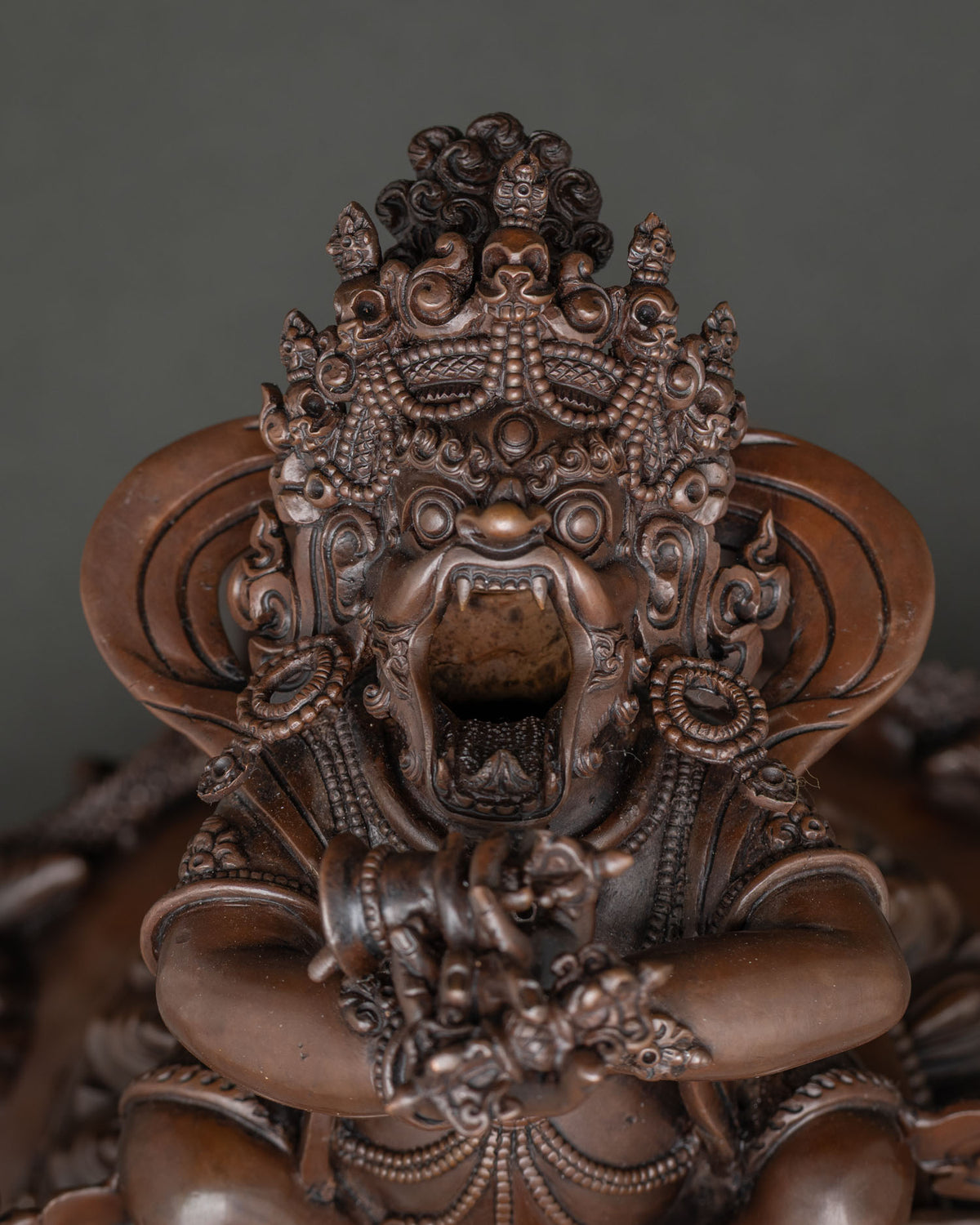Close-up of Vajradaka’s wrathful face with open mouth and skull crown