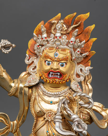 Close up of Vajrapani gold-painted face wide third eye bared fangs blazing hair intricate Newari artistry