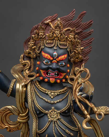 Close-up of Vajrapani Statue showing gold-gilded details and wrathful expression