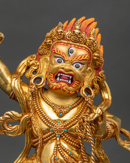 Close up of Vajrapani statue with vajra and lasso, gold-gilded copper altar statue from Nepal