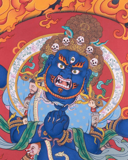 Close-up of Vajrapani's wrathful three-eyed face, skull crown, and flame halo