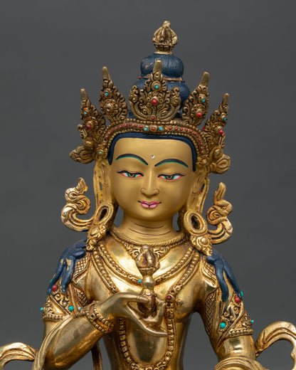 Close up of Vajrasattva face with gold painted details five jeweled crown and serene expression