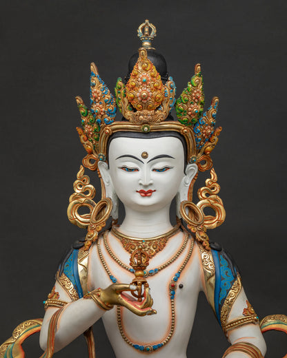 Close-up of Vajrasattva statue, gold-gilded copper Buddha sculpture with hand-painted detail