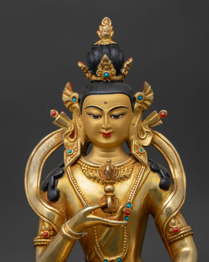 close-up of vajrasattva statue showing intricate fire-gilded gold and copper details