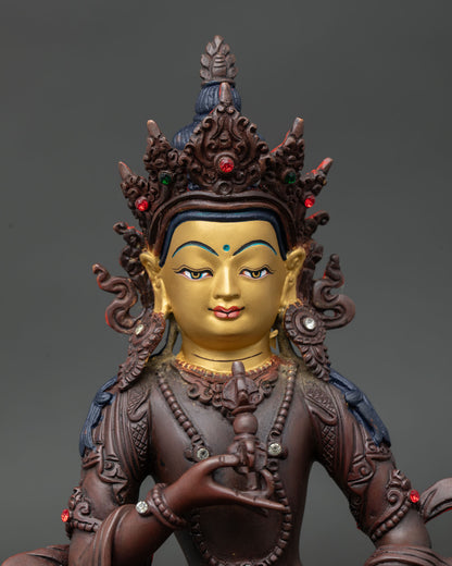 Close Up of Vajrasattva Statue with Semi Precious Stones and Serene Gold Painted Face.