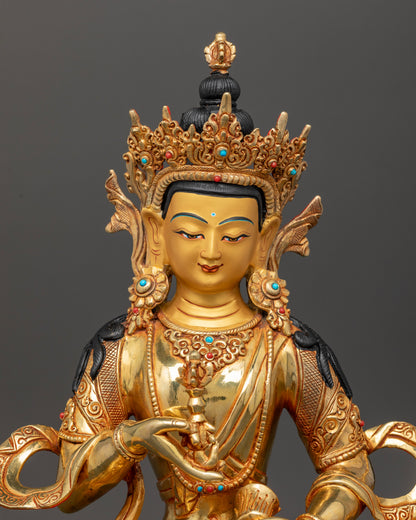 Close up of Vajrasattva statue with vajra bell and semi precious stone details
