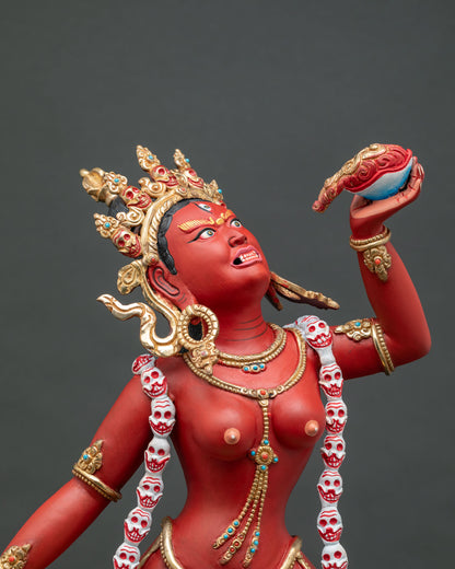Close-up of Vajrayogini statue showing skull garland and gold gilding