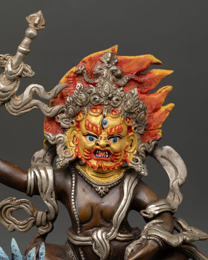 Close up of White Dzambhala face with gold gilding and hand painted details