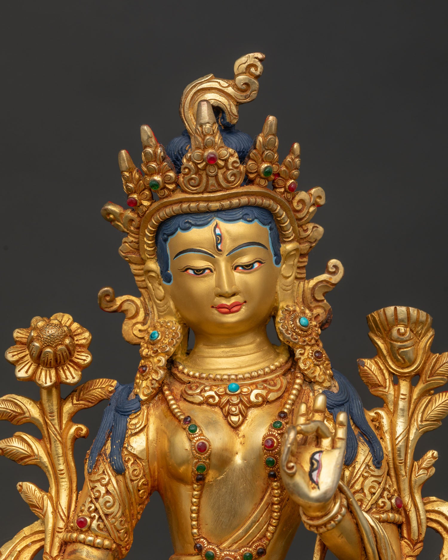 Close Up of White Tara Gold Painted Face and Five Jewel Crown.