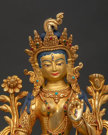 Close Up of White Tara Gold Painted Face and Five Jewel Crown.
