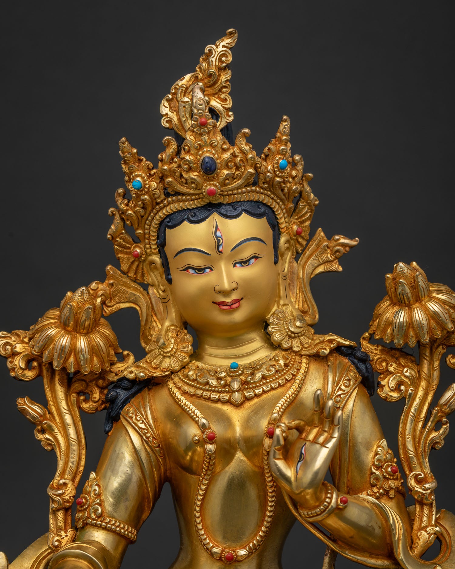 Close-up of White Tara Statue showing intricate gold fire-gilded detailing and crown