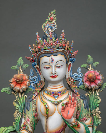 close up of white tara statue showing intricate jewelry and handcrafted nepalese details