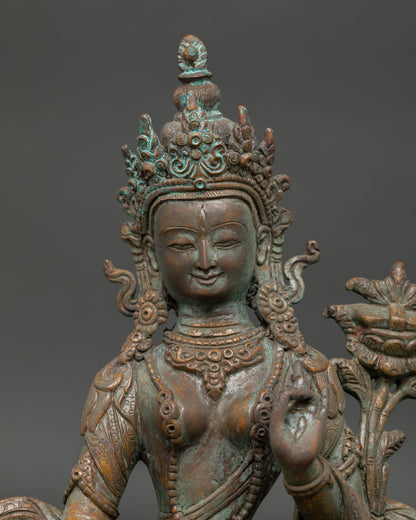 close-up of white tara statue with antique finish, handmade himalayan buddhist sculpture