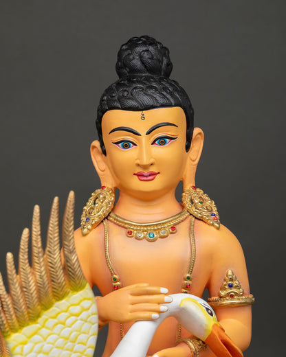 Close-up of Young Buddha Saving the Swan copper Buddhist sculpture with acrylic details