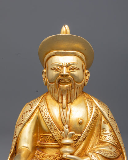 Close up of Zhabdrung Namgyal statue showing fire gilded gold and intricate details