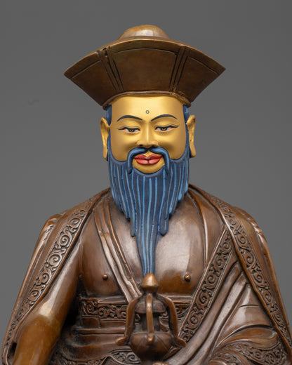 close up of zhabdrung rinpoche statue showing oxidized copper and acrylic detailing