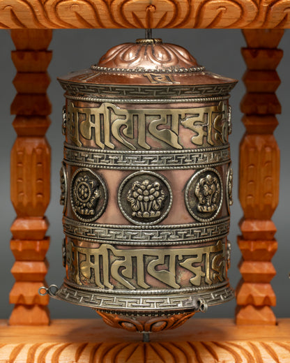 Close up Om Mani Padme Hum engraved prayer wheel copper mantra wheel