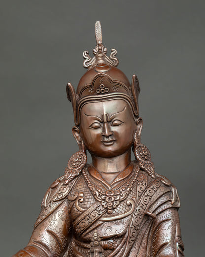 Close up Padmasambhava sculpture showing detailed facial expression and intricate Himalayan metal craftsmanship in oxidized finish