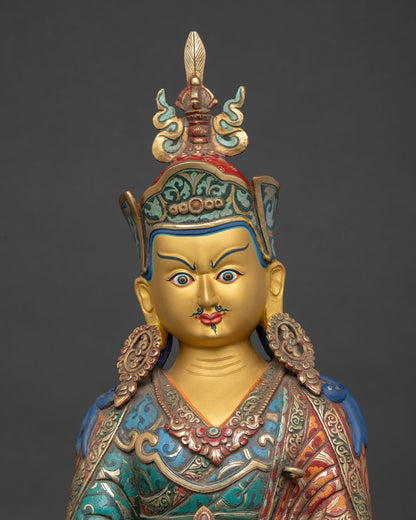 Close-up Padmasambhava Statue holding vajra kapala and khatvanga trident, tantric Buddhist deity, sacred detail