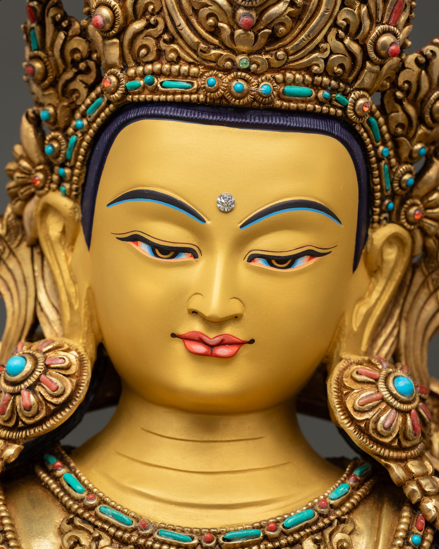 Close-up portrait of Manjushri Bodhisattva with hand-painted face and serene expression