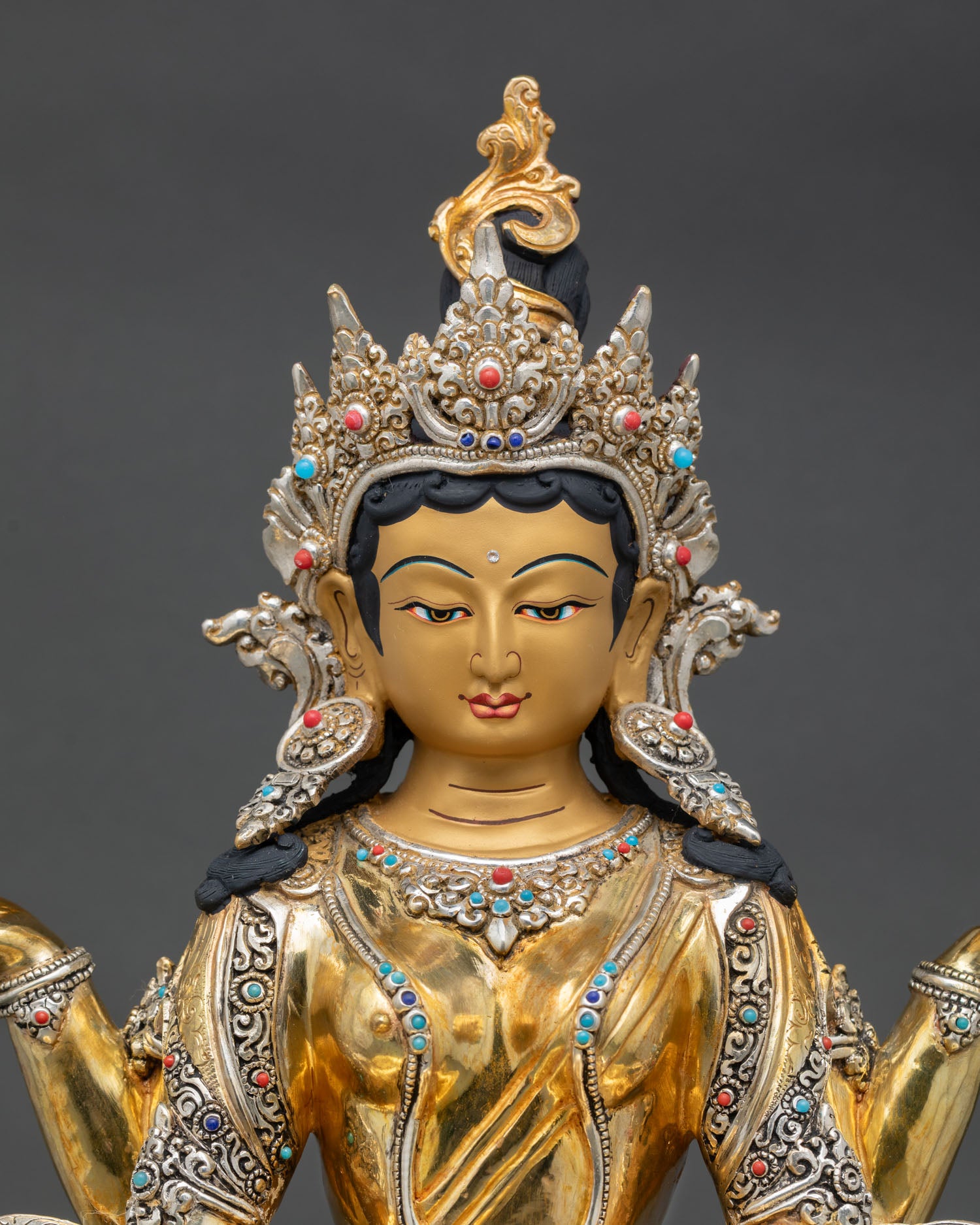 Close up Prajnaparamita altar statue hand painted face Himalayan Buddhist art