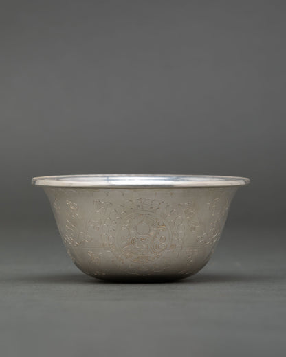 Close up pure silver Buddhist offering bowl handmade by Newari artisan from Patan Nepal