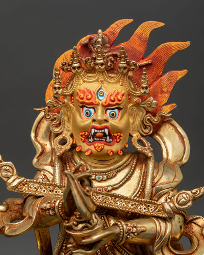 Close up of Sakya Mahakala face with gold painted details and semi precious stones