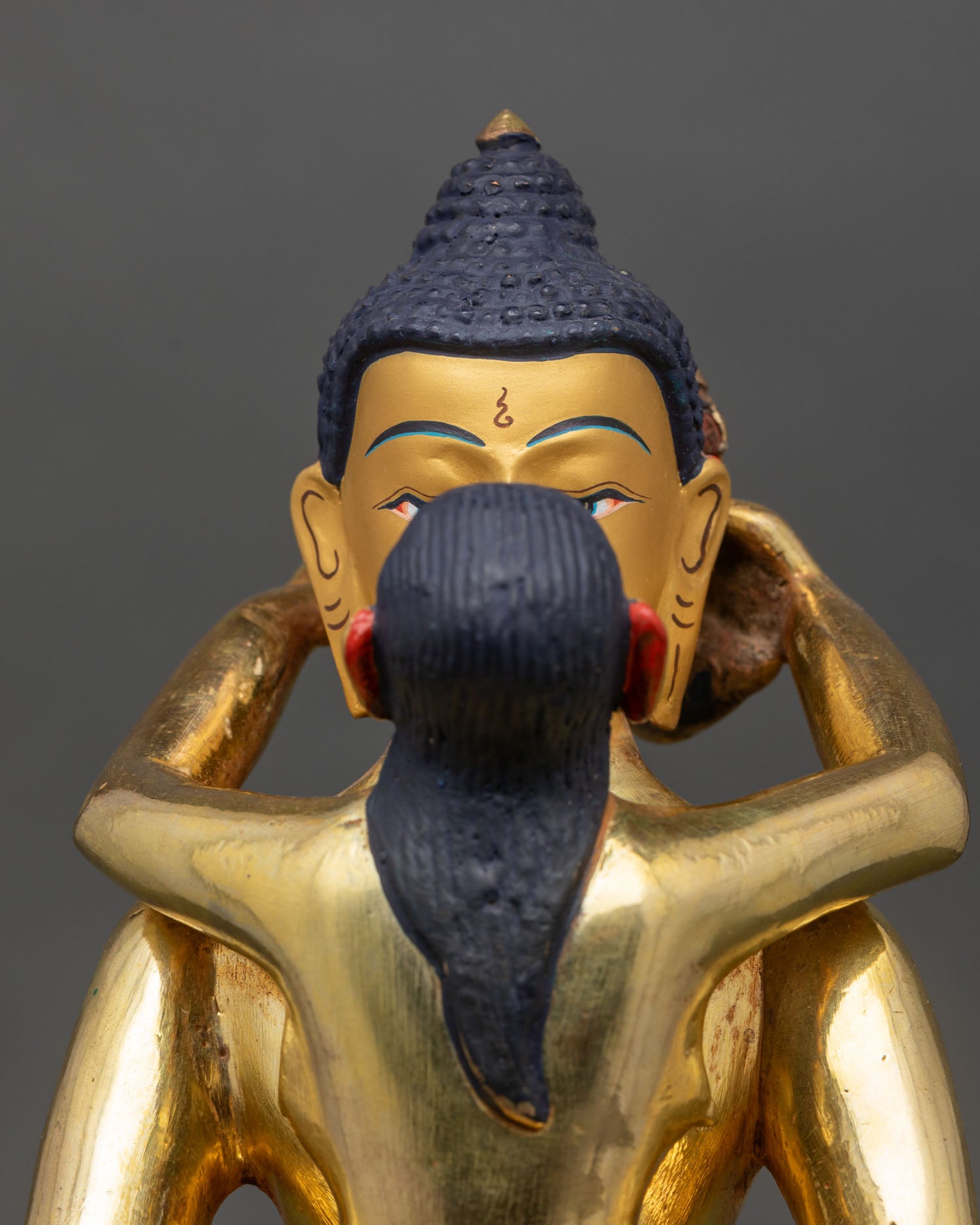 Close up Samantabhadra consort face detail gold painted finish semi precious stones Himalayan Buddhist statue floral halo sacred craftsmanship