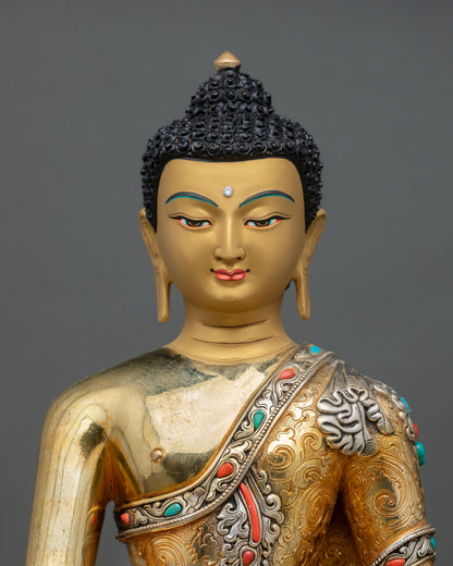 Close up Shakyamuni Buddha face detail gold painted finish silver plated accents semi precious stones, Vajrayana Buddhist sculpture Himalayan craftsmanship