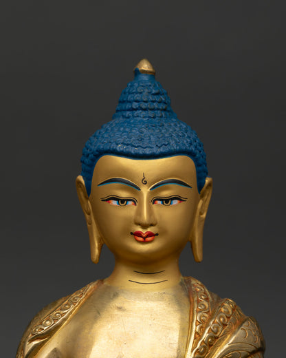 Close up Shakyamuni Buddha face detail gold painted serenity bhumisparsha mudra buddhist art