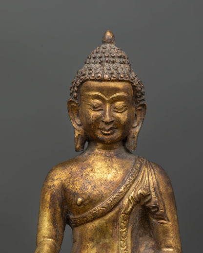 Close up Shakyamuni Buddha face detail serene expression hand crafted lost wax casting, spiritual enlightenment statue