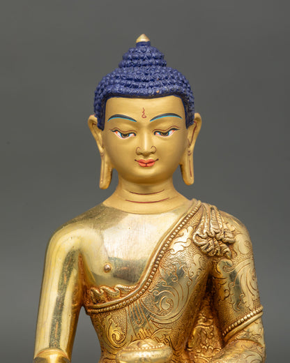 Close up Shakyamuni Buddha face gold-painted serene expression with intricate floral motifs