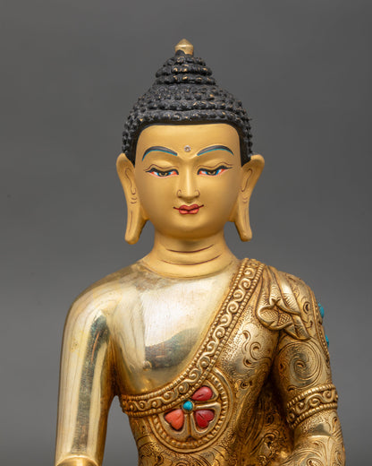 Close up Shakyamuni Buddha gold painted face Bhumisparsha mudra turquoise coral inlays