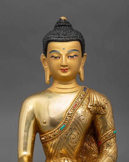 Close up Shakyamuni Buddha gold painted face, Earth Touching mudra, semi-precious stones
