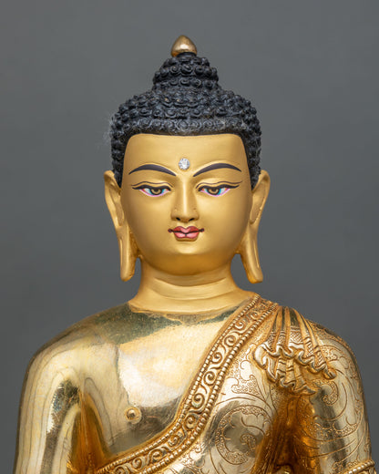 Close up Shakyamuni Buddha sculpture with gold painted face 