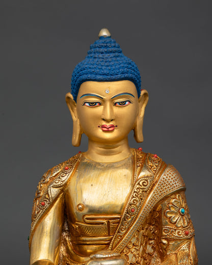 Close up Shakyamuni Buddha serene face with hand painted gold finish symbolizing enlightenment wisdom and inner peace