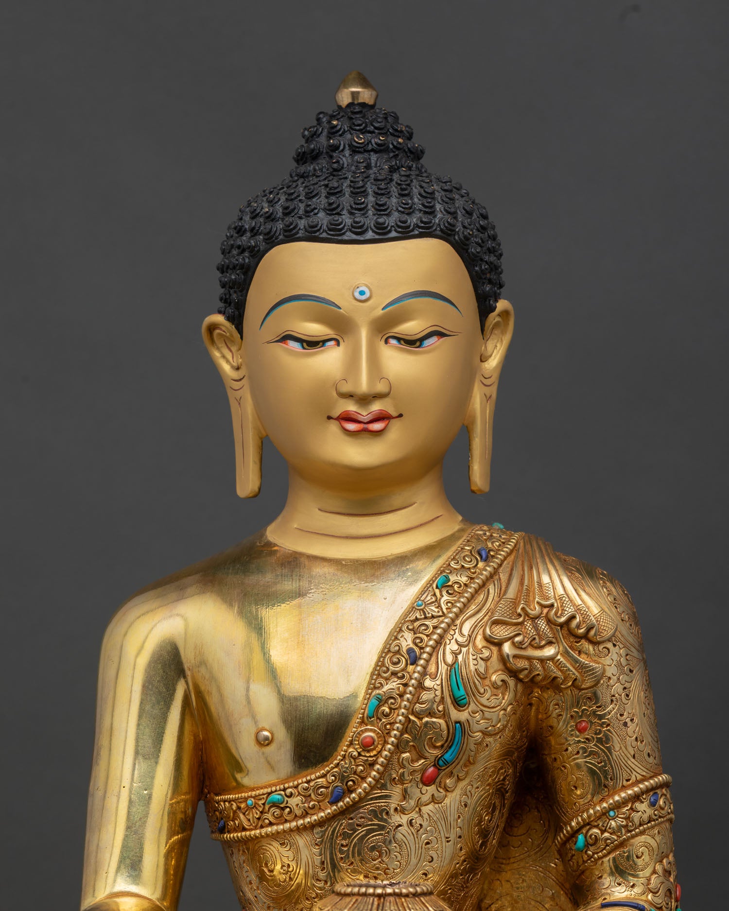 close up shakyamuni buddha statue, gold gilded copper with intricate details