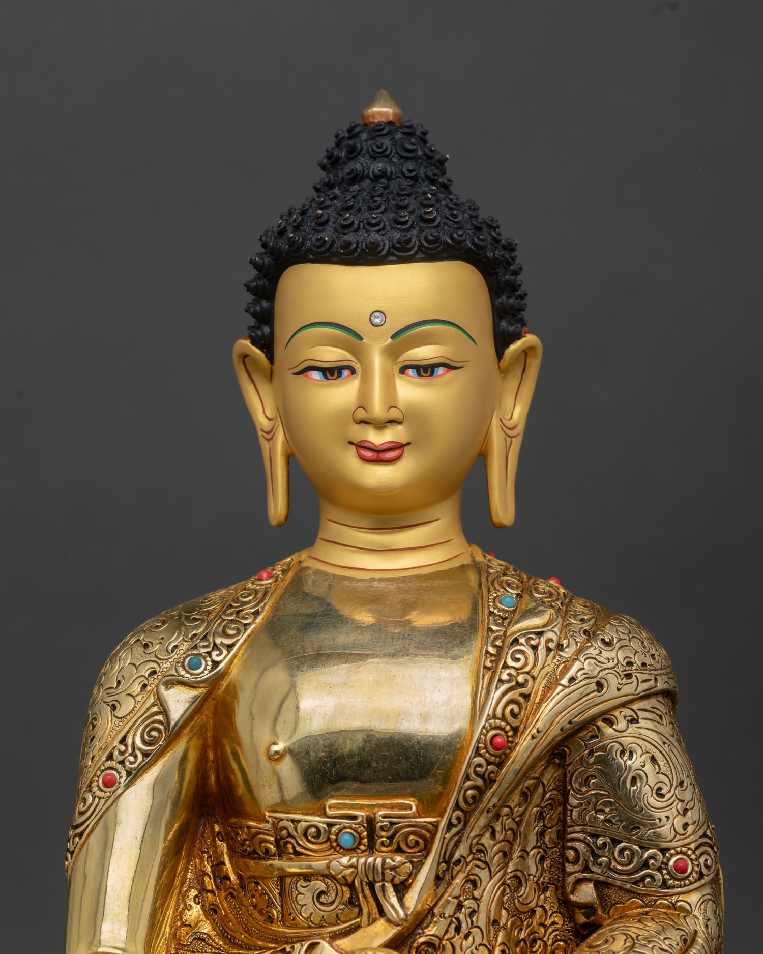 Close up Shakyamuni Buddha Statue, handcrafted copper with gold gilding details