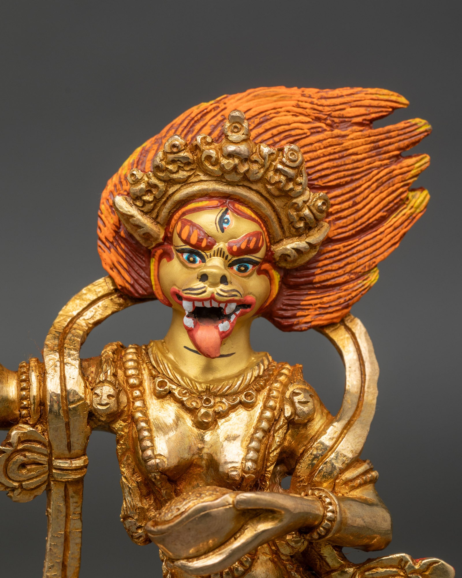 Close up Simha Mukha face third eye five skull crown skull garland Himalayan tantric art