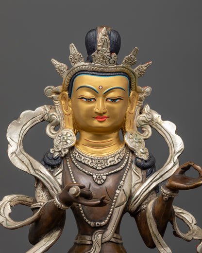 Close up simhanada chenrezig statue with 24k gold painted face and ornate crown.