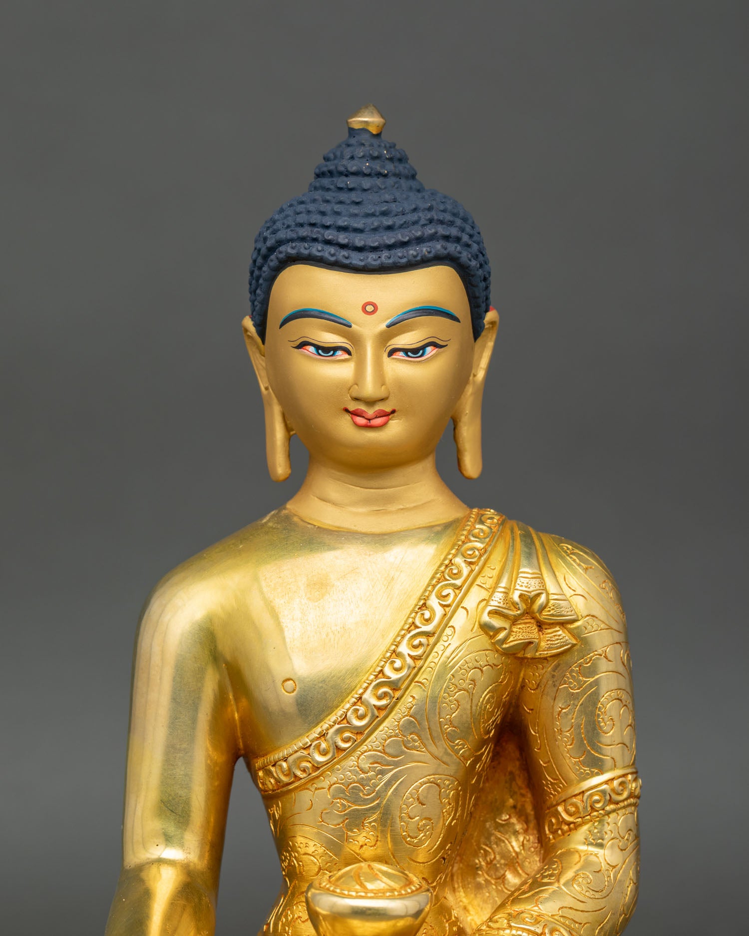 Close up Tathagata Shakyamuni Buddha gold painted face 