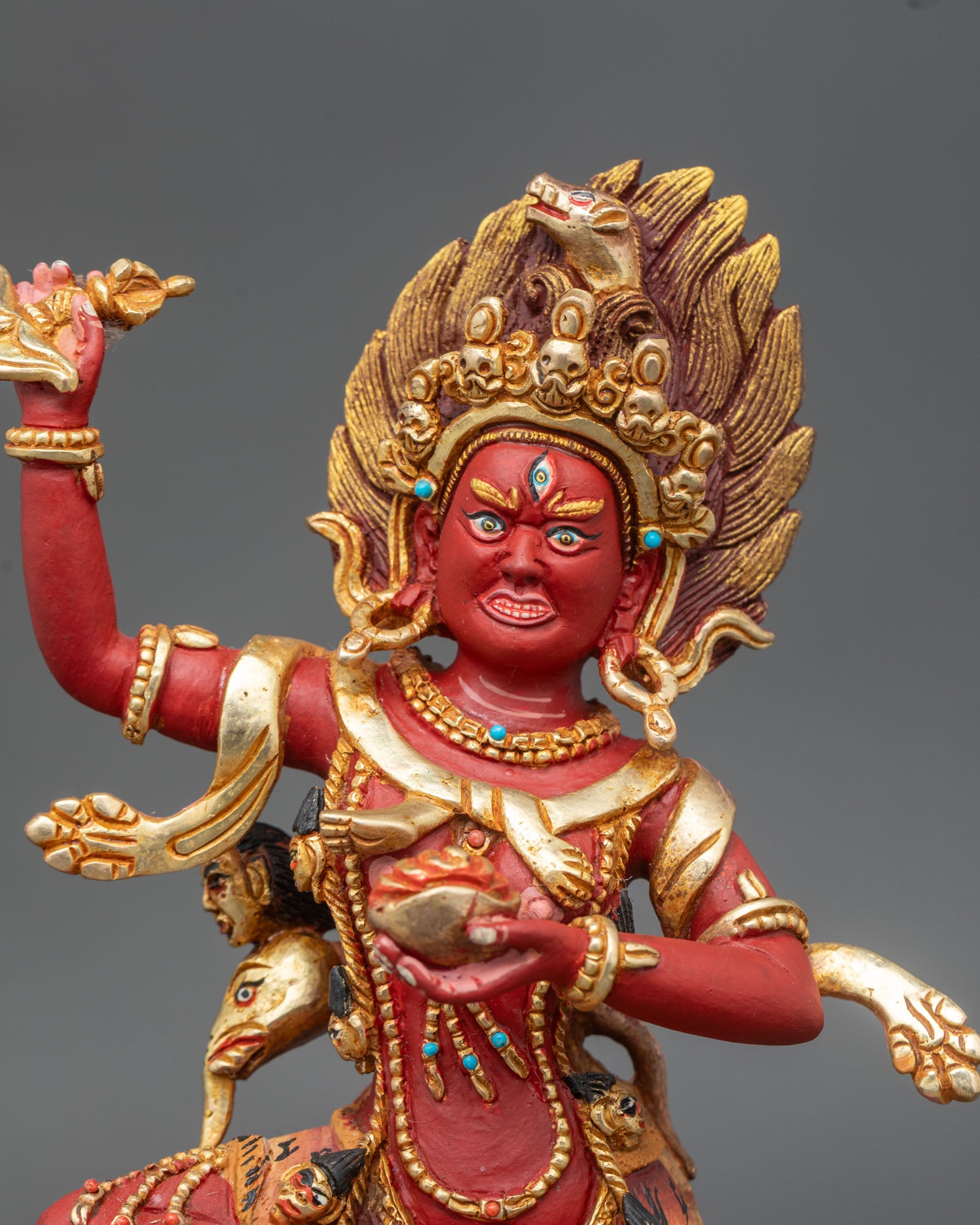 Close up of Troma Nagmo buddhist dakini face with halo, three eyes, and skull crown