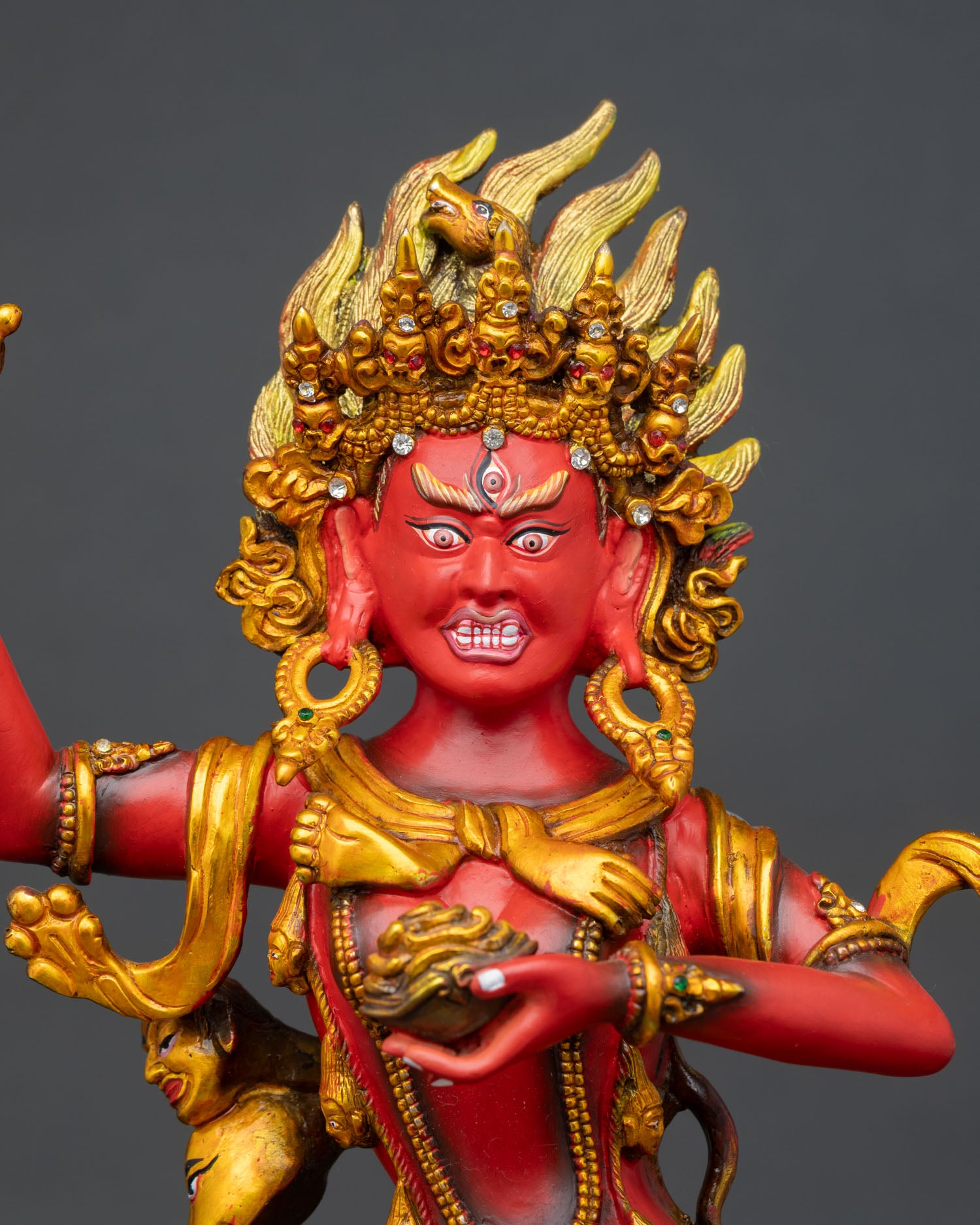 Close-up Troma Nagmo statue, copper Vajrayana art, gold finish, ritual detail