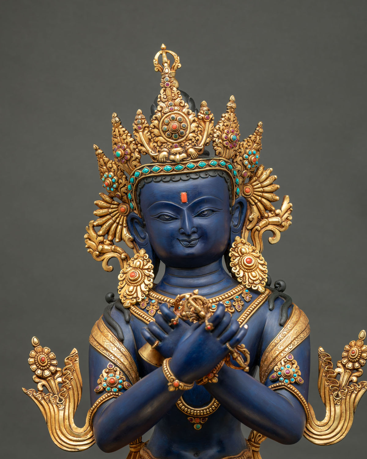 Close-up of Vajradhara statue, hand painted blue Buddha with gold crown, Newari craftsmanship