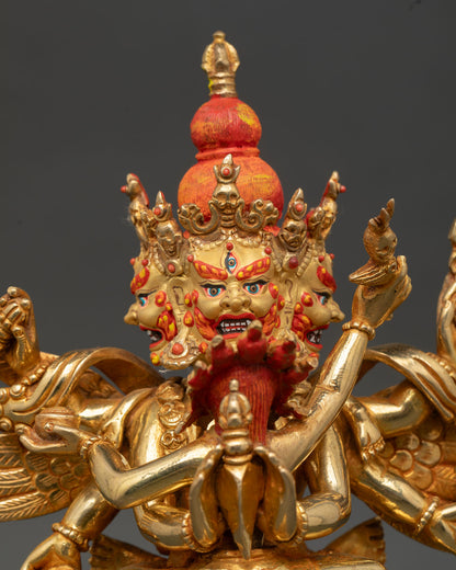 Close up Vajrakilaya statue gold painted face coral stone detail Newari artisan craftsmanship Vajrayana wrathful deity spiritual art