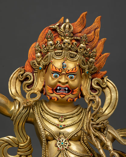 Close up Vajrapani Statue gold painted face five skull diadem tiger skin garment wrathful Buddhist protector deity detail