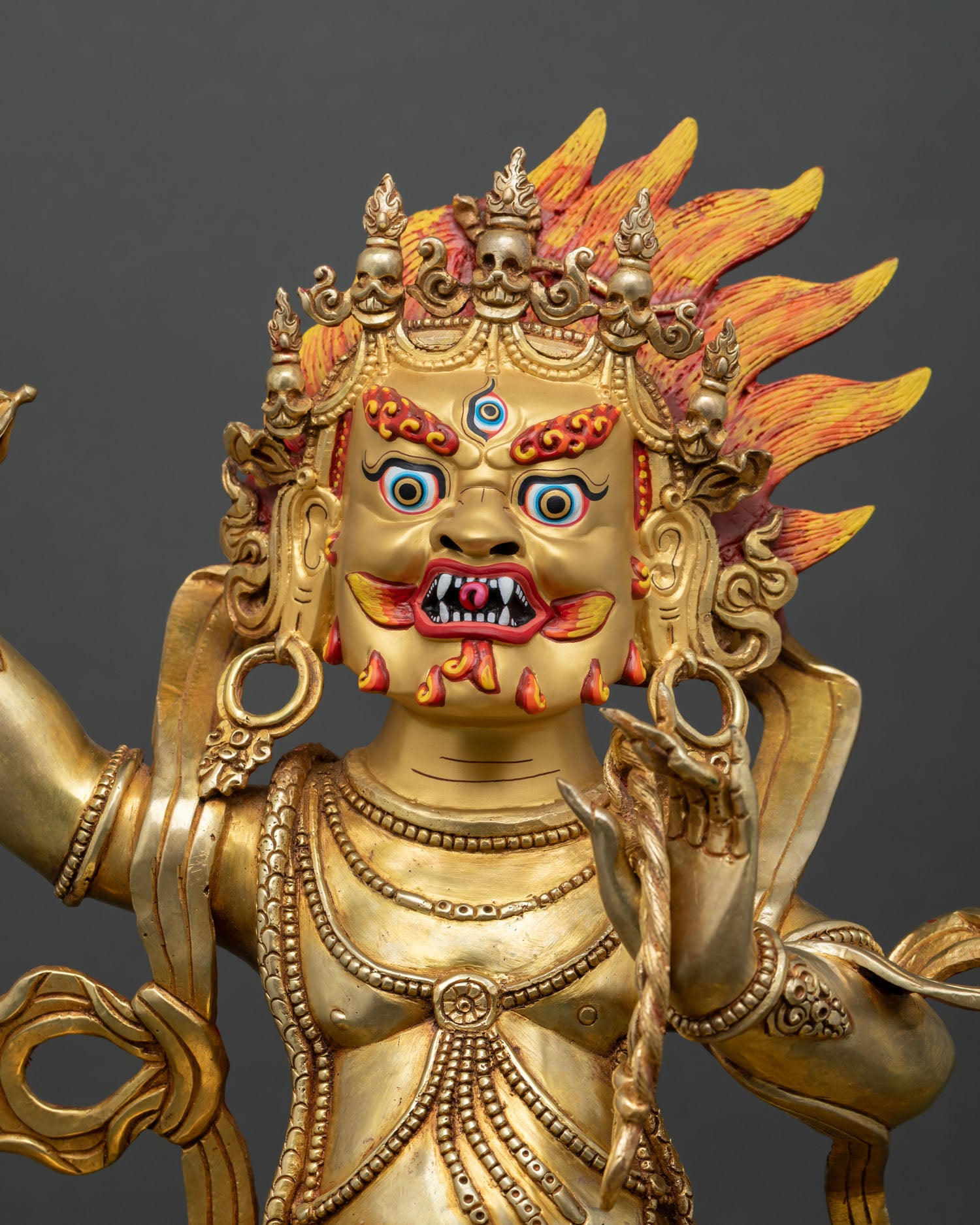 Close up Vajrapani wrathful expression in dynamic posture symbolizing protector of Dharma
