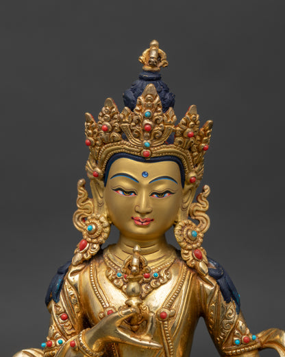 Close up Vajrasattva sacred figure intricately carved robes precious stones spiritual practice